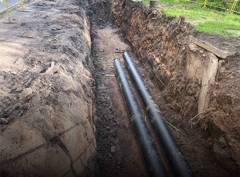 Two pipes in the dirt about 3-4 feet. Ditching service to reduce flooding.