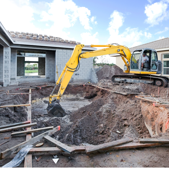 Excavator machine, excavating a residential yard to add a swimming pool.